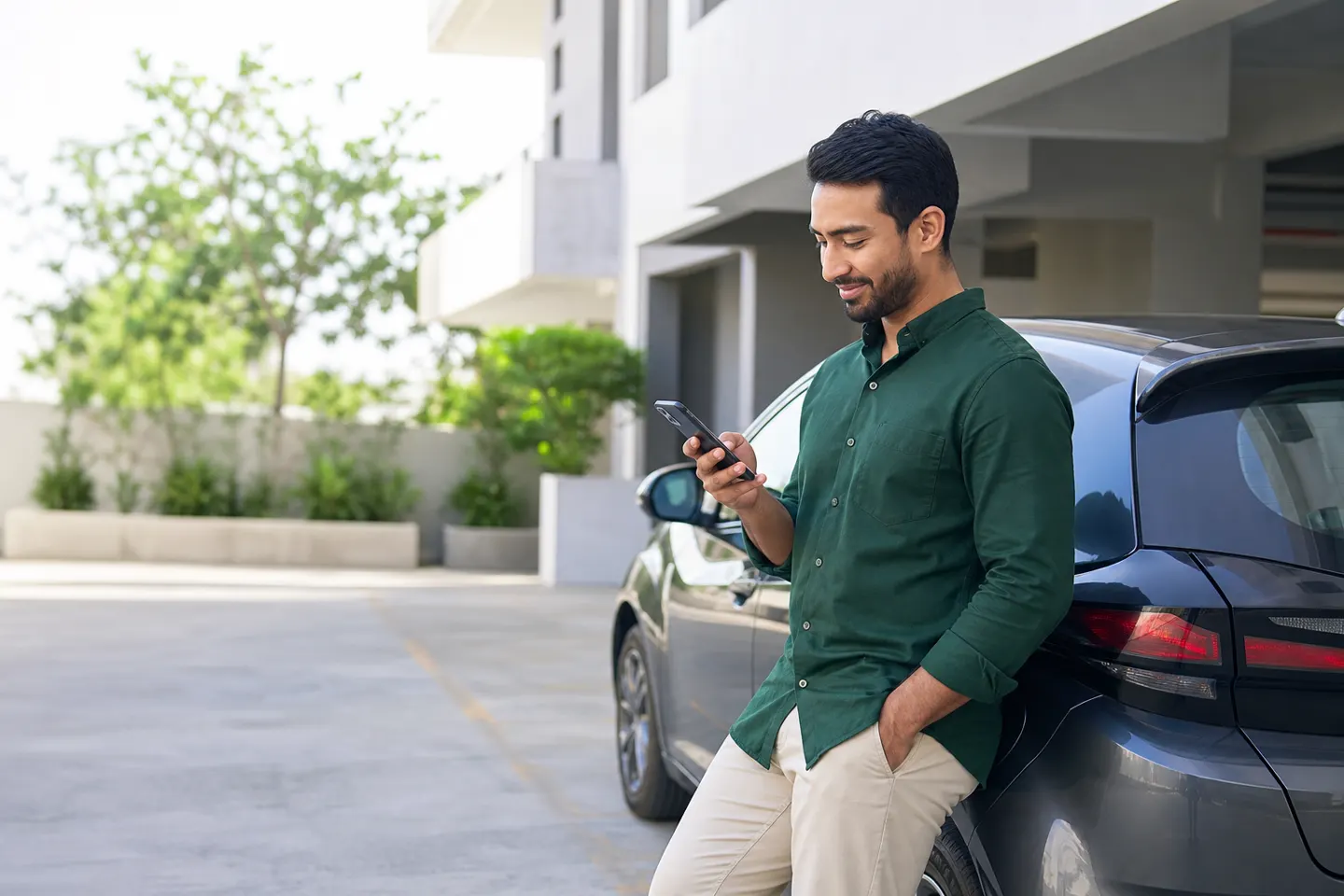 Receiving a timely car insurance reminder beside a family car